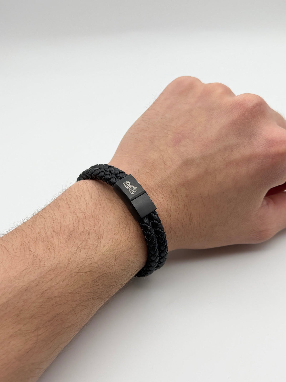 KNOTT leather bracelet with clasp, worn on wrist